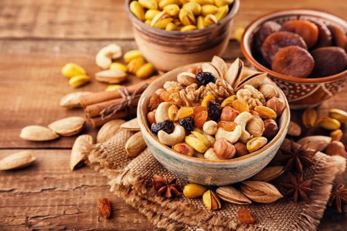 Mix,Of,Nuts,And,Dried,Fruits,On,A,Old,Rustic